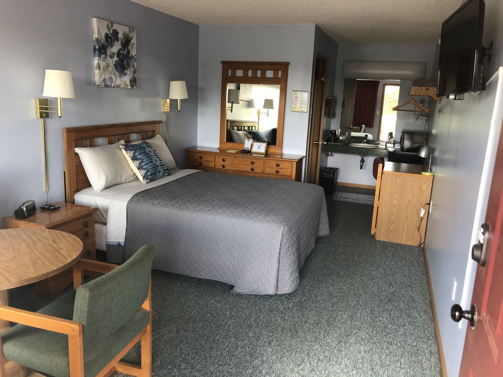 Queen guest room with a queen bed